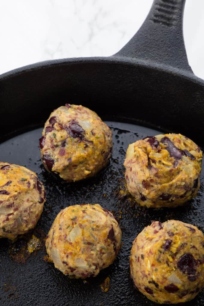 Five vegan meatballs in a pan