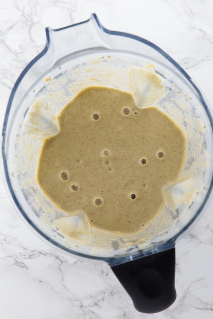 Healthy banana smoothie with chia seeds in a blender