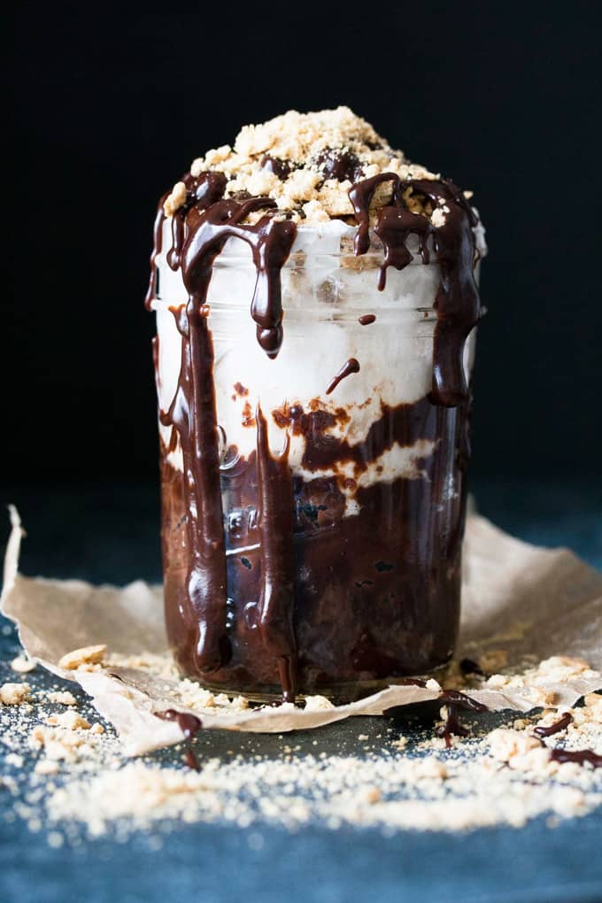 chocolate lava cake in a glass with chocolate dripping down and a blackground
