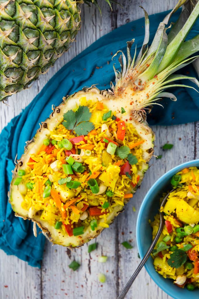 Thai Pineapple Fried Rice in a Pineapple Shell with Green Onions and Cilantro on Top