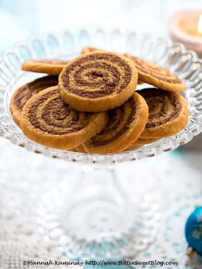 vegan cookie butter pinwheels on a glass cookie platter