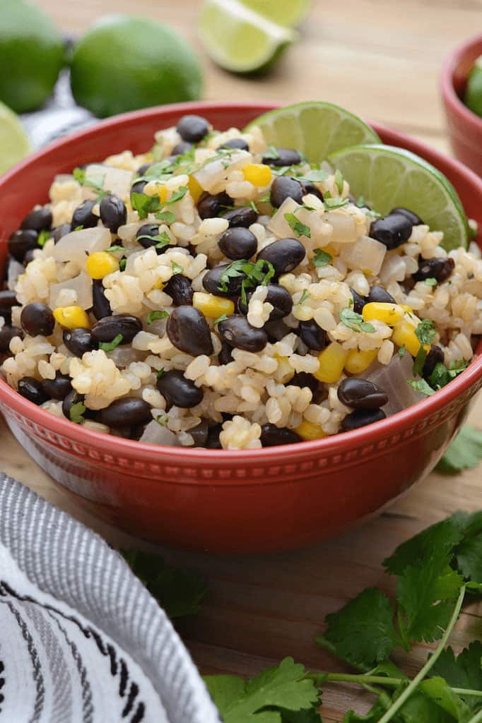 red bowl of black beans and lime rice