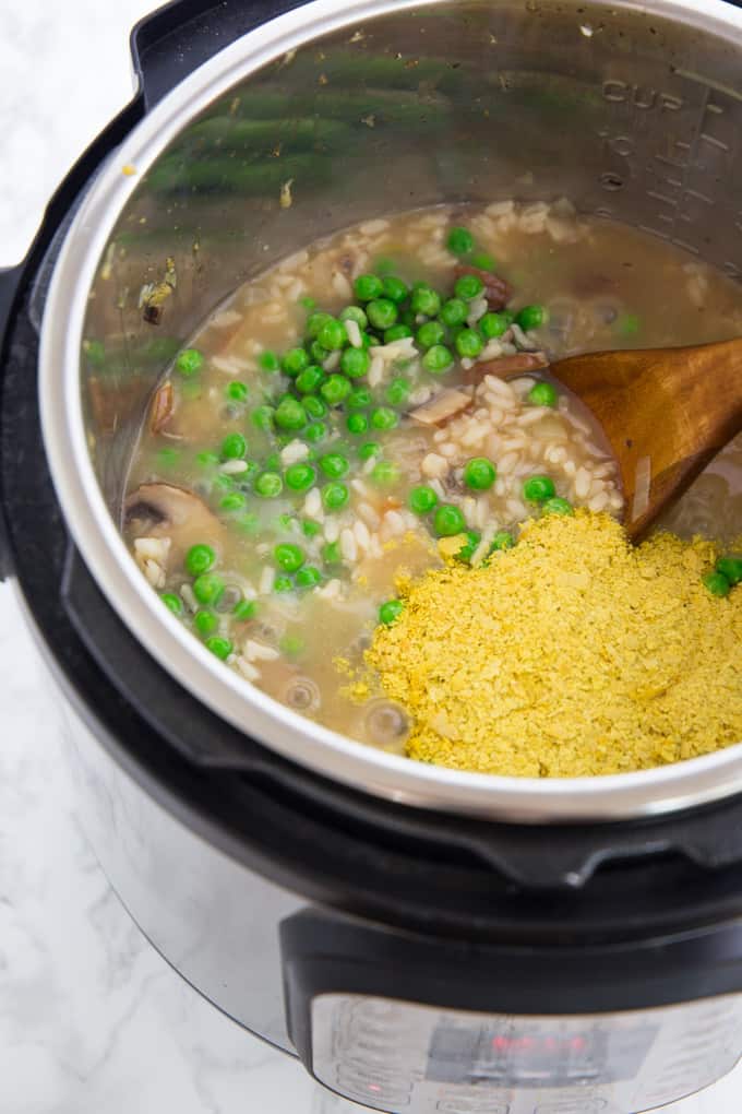 Peas and Nutritional Yeast are added to instant pot risotto