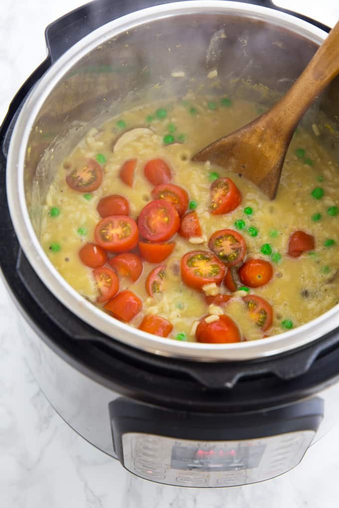 vegan mushroom risotto in instant pot with cherry tomatoes