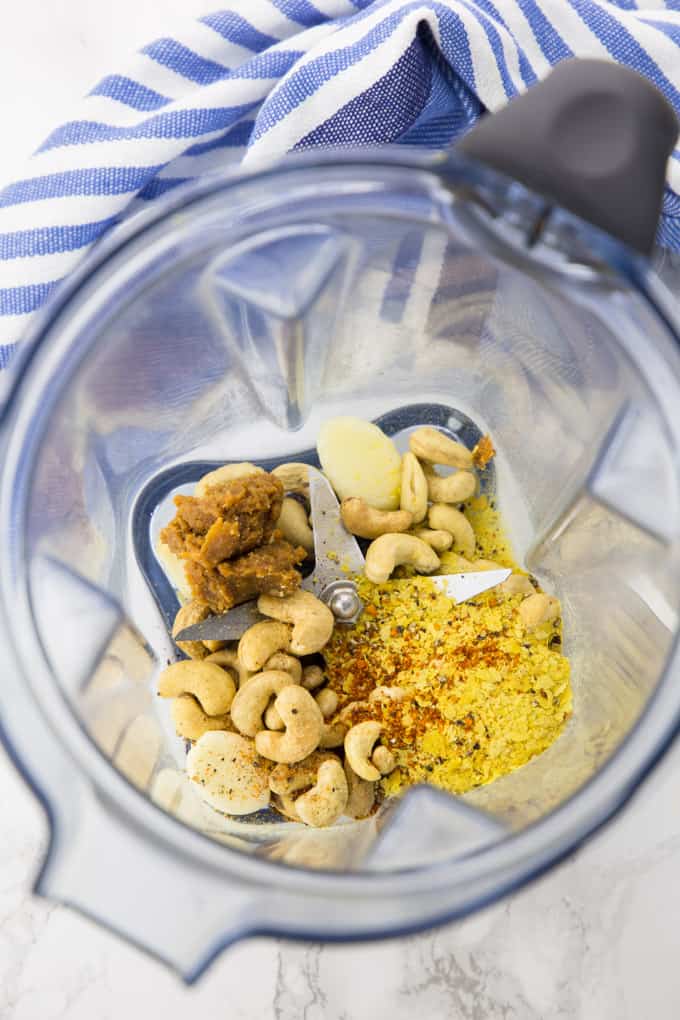 cashews, nutritional yeast, miso paste, and garlic in a high speed blender
