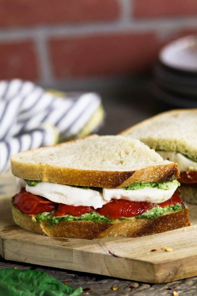 Roasted Red Pepper Sandwich with Vegan Mozzarella on a Wooden Board