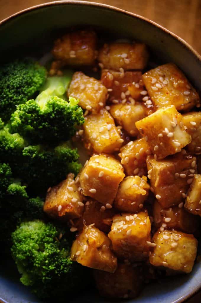 A Bowl of Sticky Maple Ginger Tofu with Broccoli and Sesame on Top