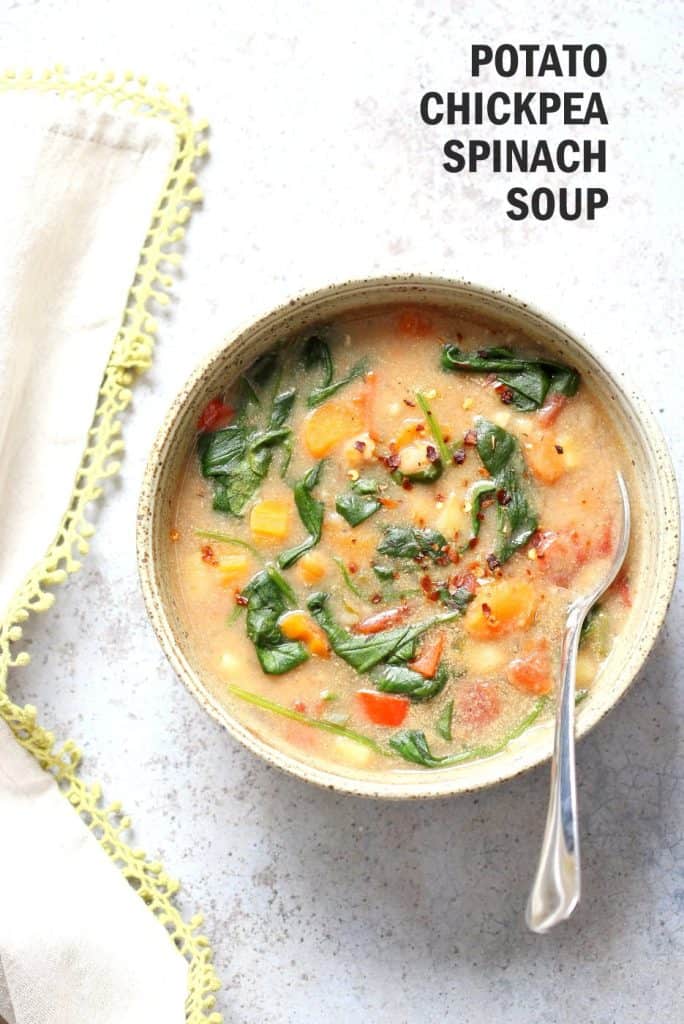 Veggie Chickpea Potato Soup in a Bowl with a Spoon