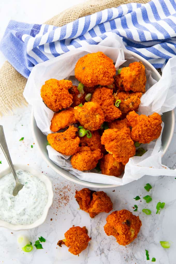Cauliflower Buffalo Wings in a Bowl with Ranch Sauce on the Side
