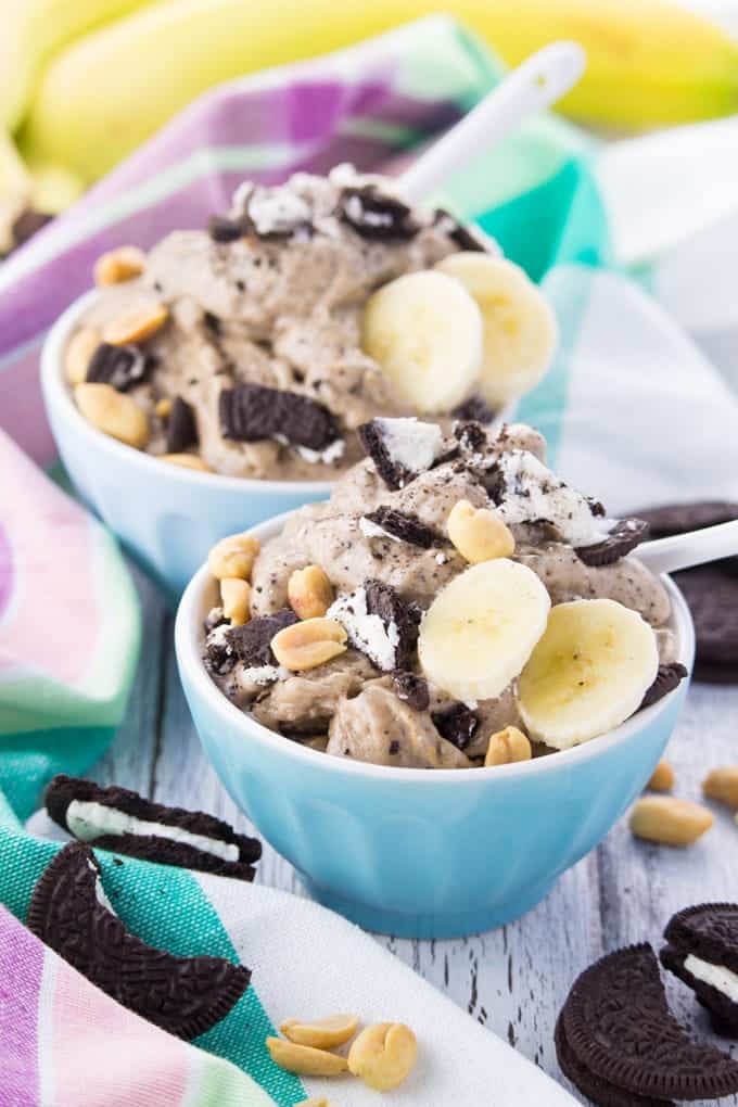 Vegan Oreo Ice Cream in Two Cups with Bananas and Peanuts on Top