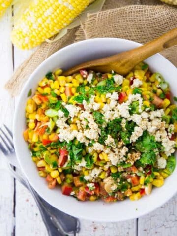 Mexican Street Corn Salad with cilantro and crumbled tofu on top