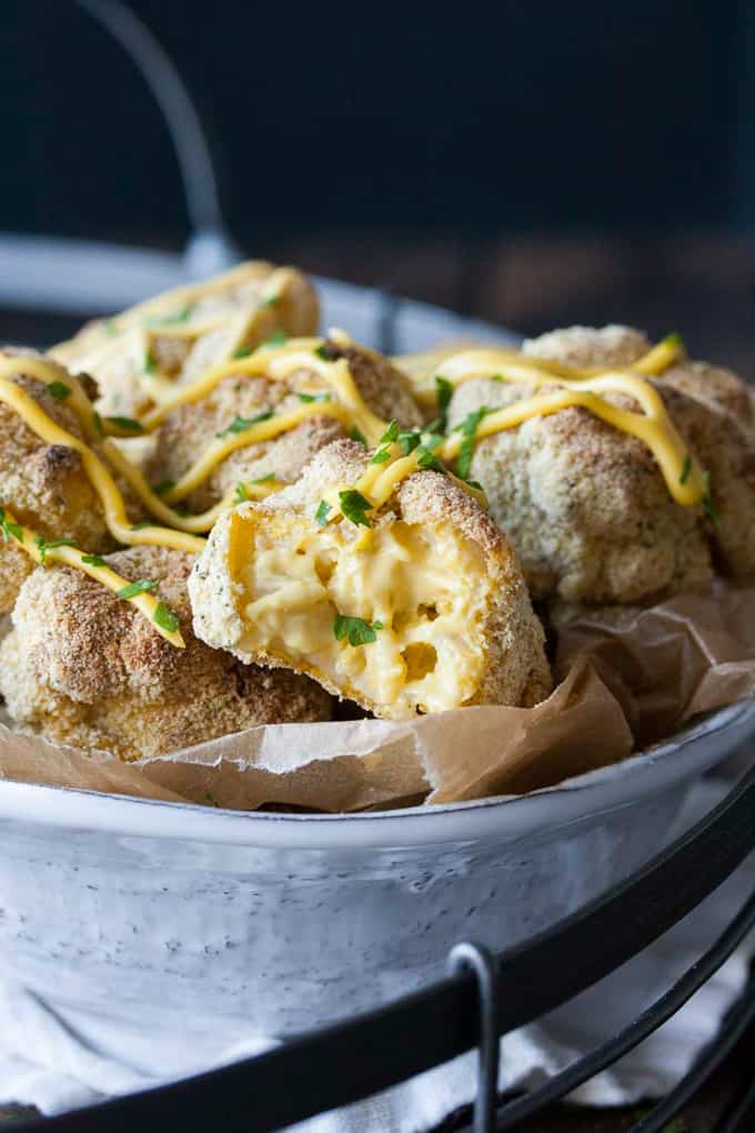 Baked Mac and Cheese Balls in a metal bowl with a black background