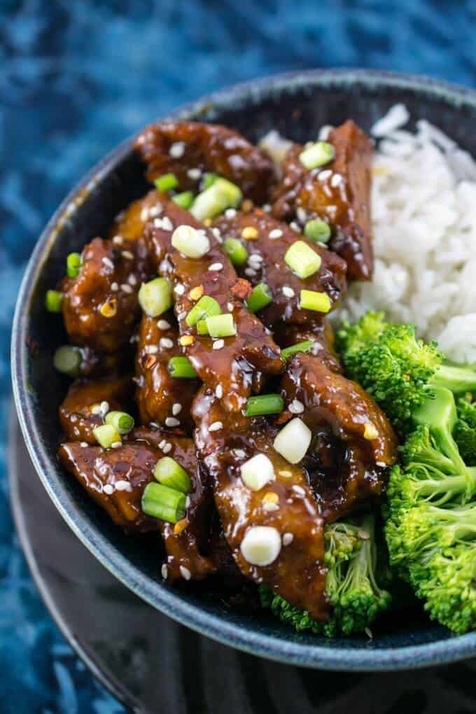 Mongolian Seitan Vegan Beef in a Bowl with Rice and Broccoli and Green Onions on Top 