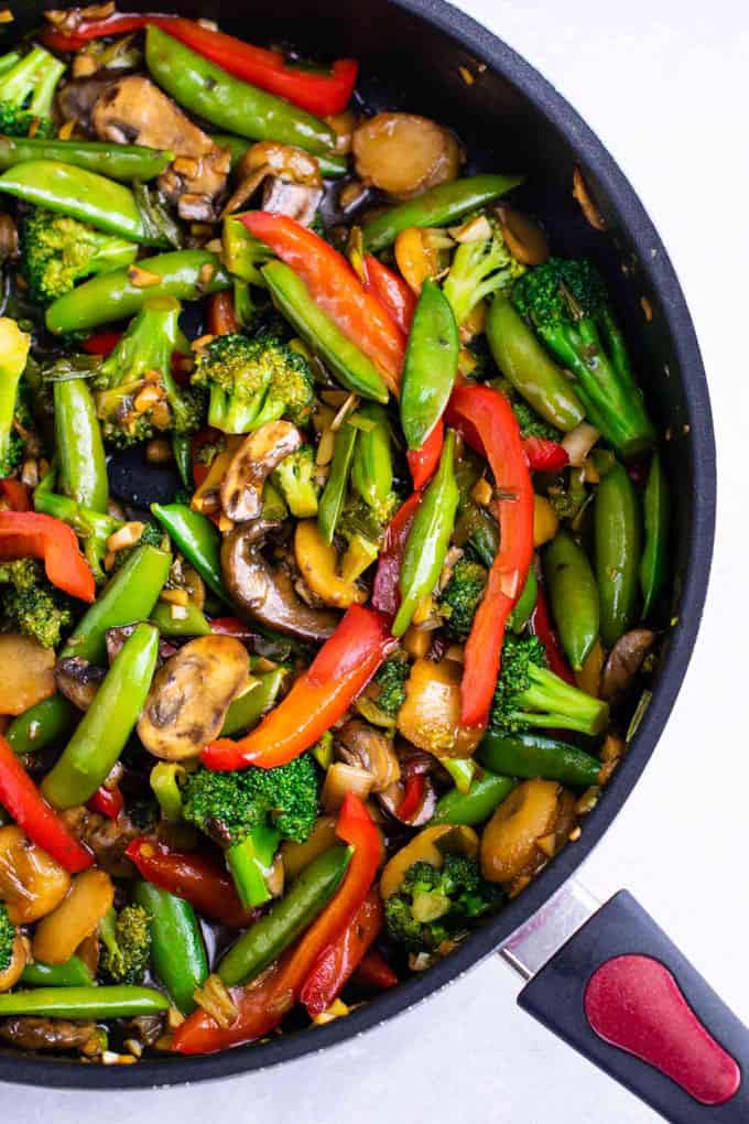 Stir Fry Vegetables in a black pan on a white countertop