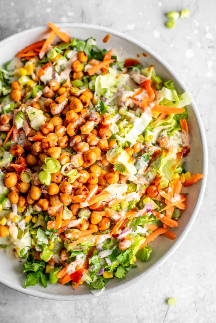 Vegan BBQ Chickpea Salad in a white bowl on a concrete countertop 