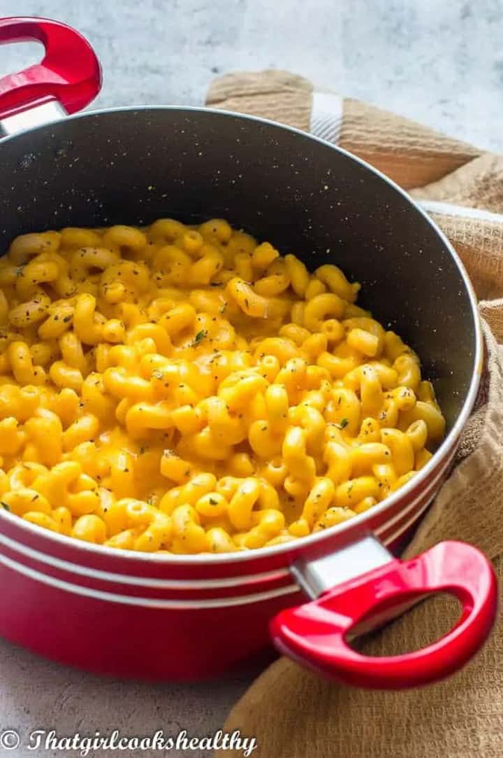 Sweet Potato Mac and Cheese in a red pot on a concrete countertop 