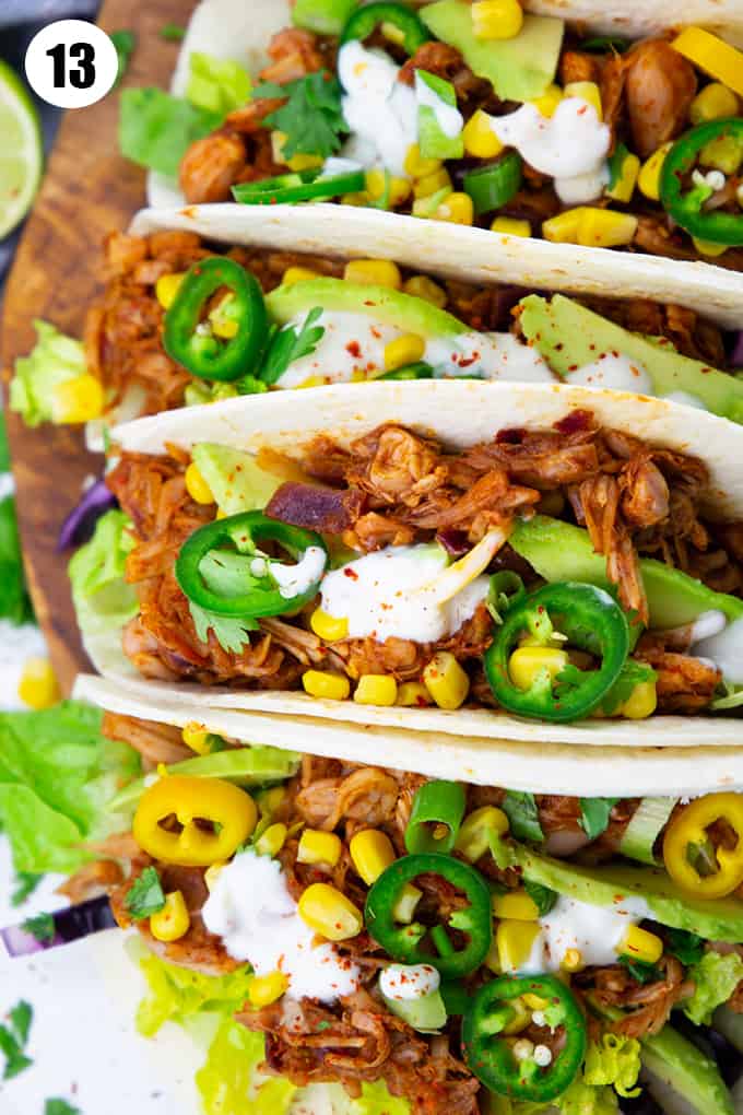 close-up of jackfruit tacos filled with corn and lettuce