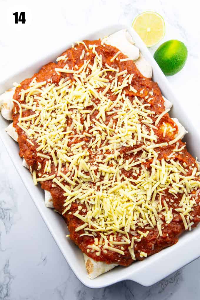 vegan enchiladas in a baking dish topped with vegan cheese 