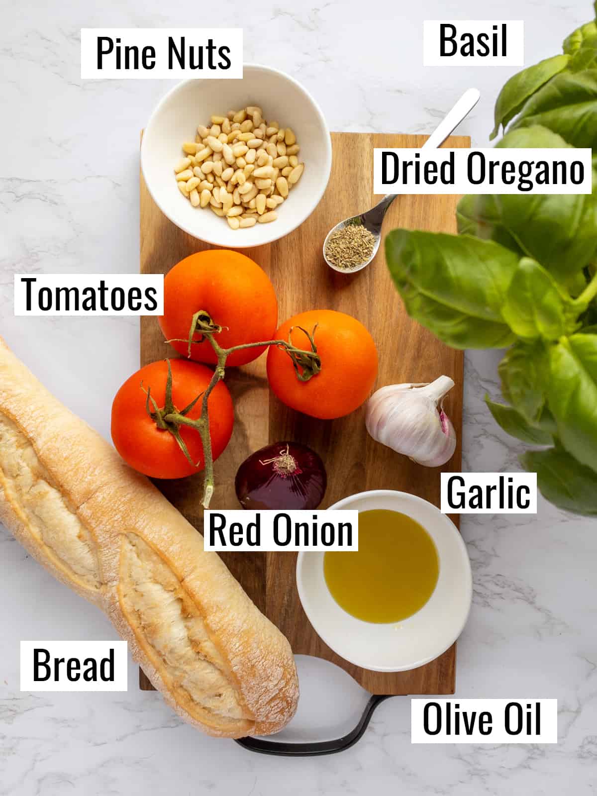 the ingredients that go into this recipe on a marble countertop with labels 