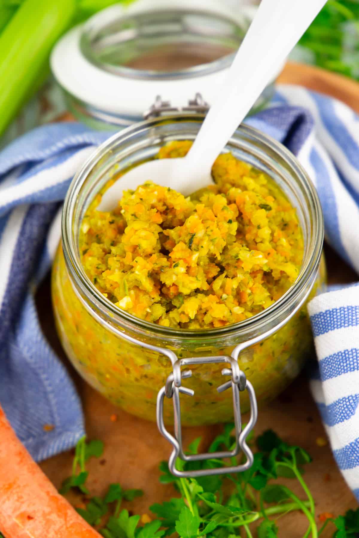 vegetable paste in a glass jar with a white spoon