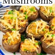 vegan stuffed mushrooms on a white plate with a text overlay