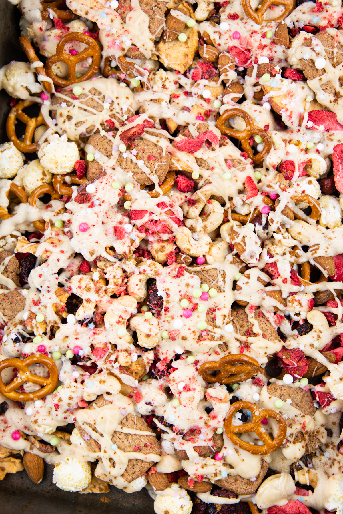 vegan Christmas crunch with popcorn, snack pretzels, and white chocolate 