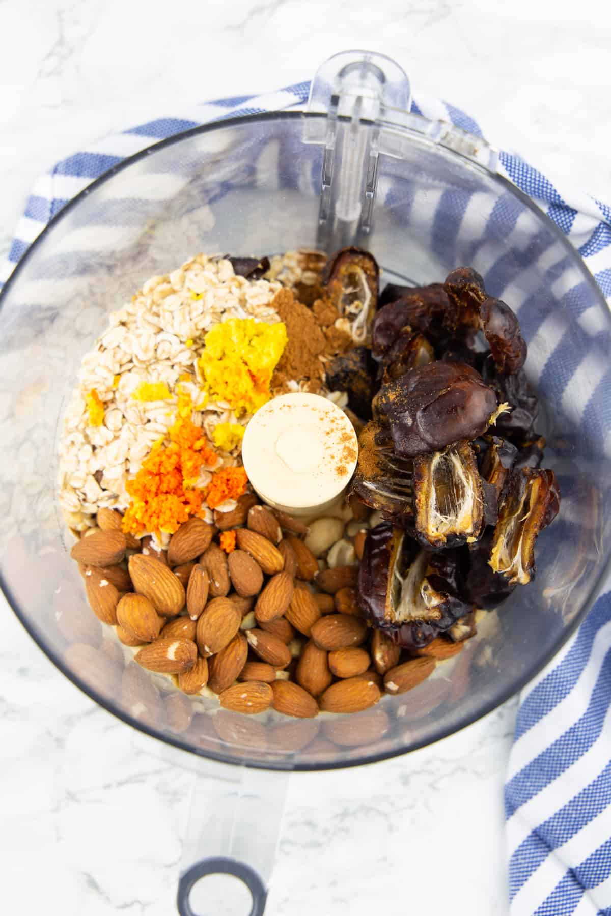 the ingredients for these energy balls in a food processor before blending 