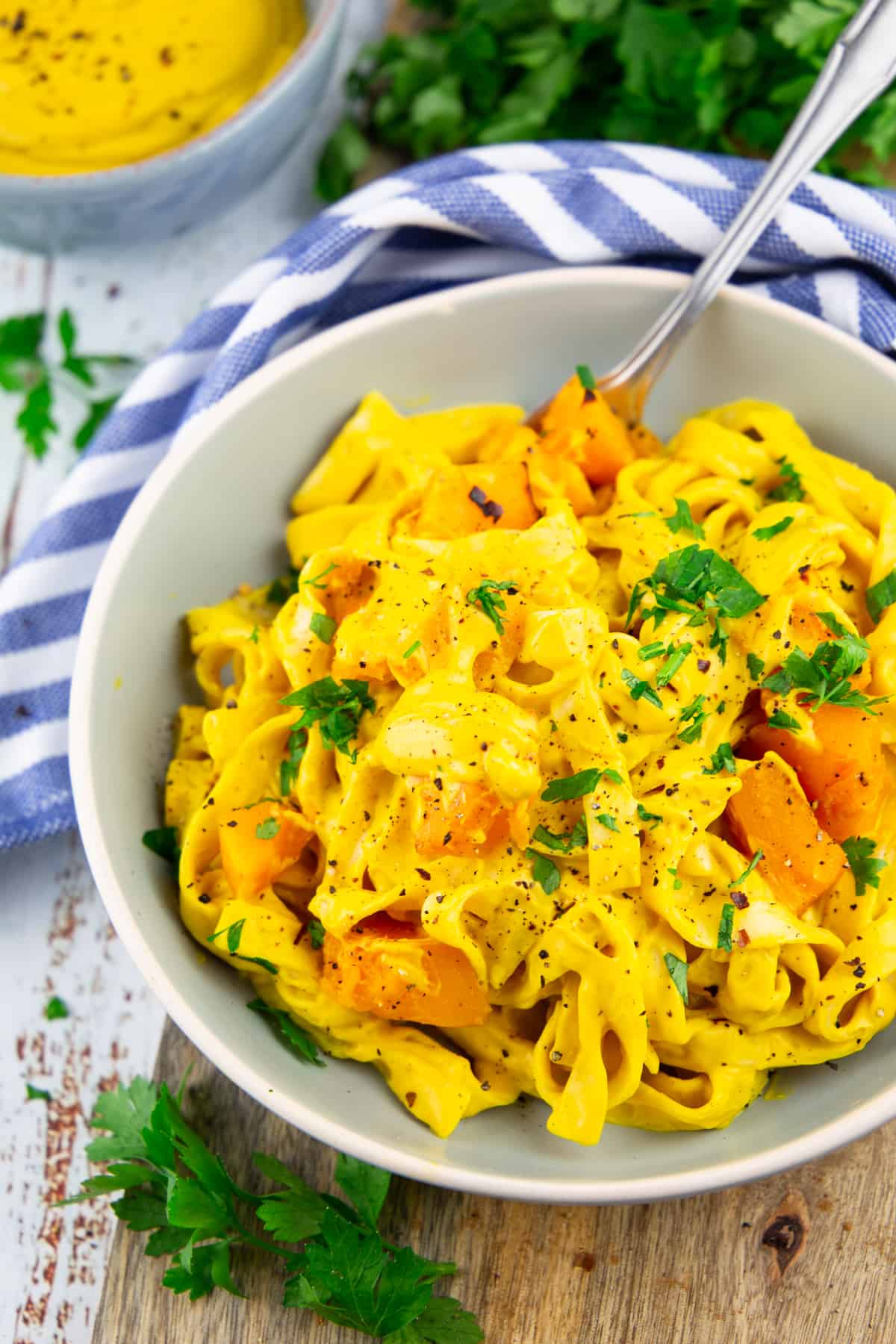 fettuccine with creamy pumpkin sauce in a gray plate 