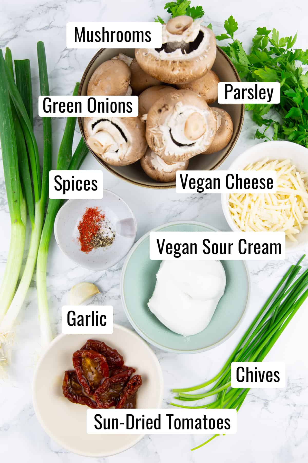 the ingredients that go into this recipe on a marble countertop with labels with the name of each ingredient 