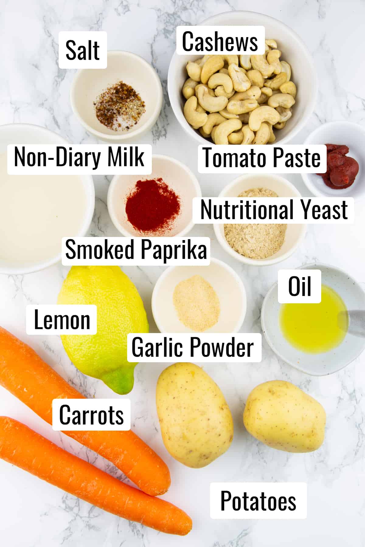 the ingredients that go into this recipe on a marble countertop with the names of each ingredient