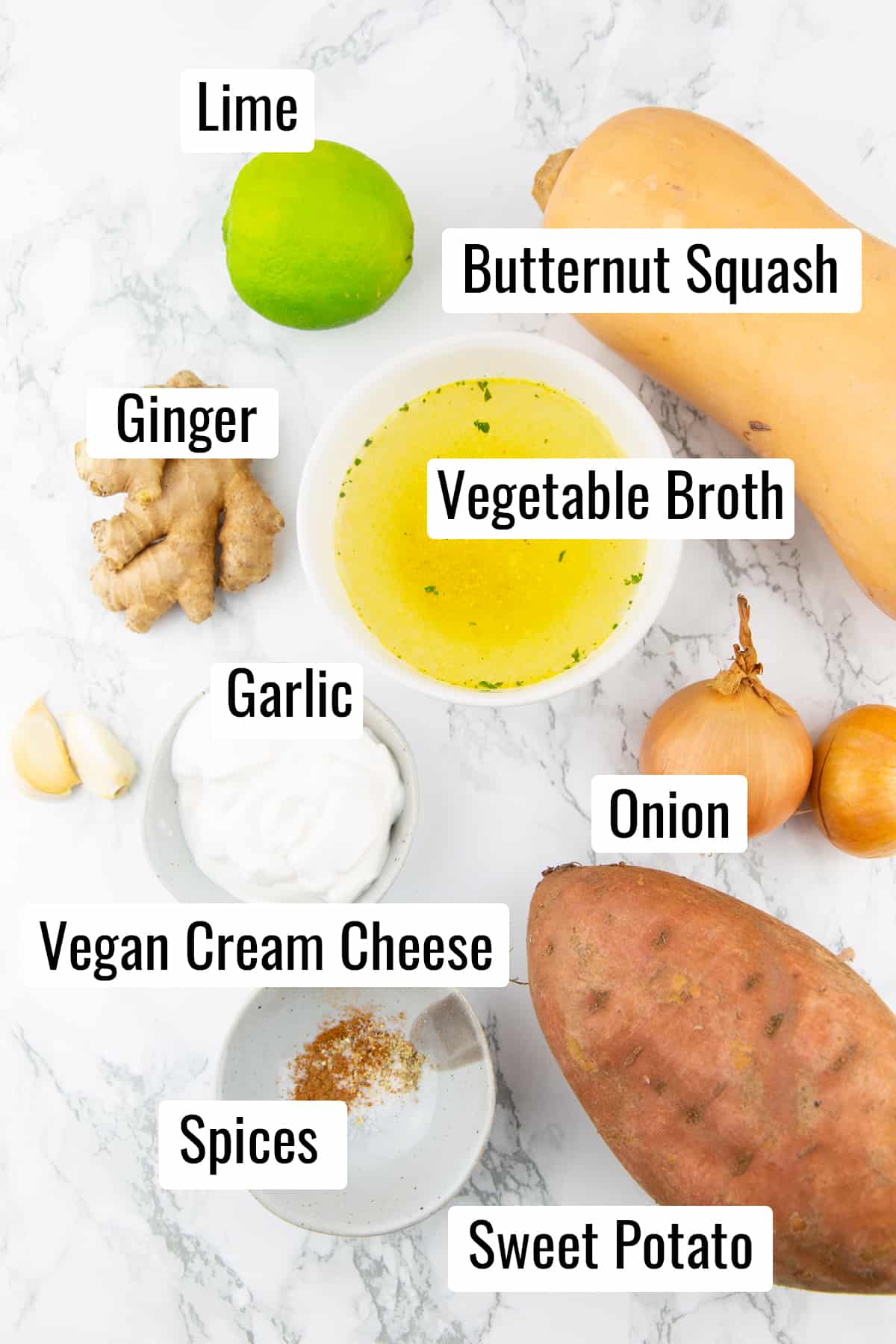 the ingredients that go into this recipe on a marble countertop with labels with the name of each ingredient