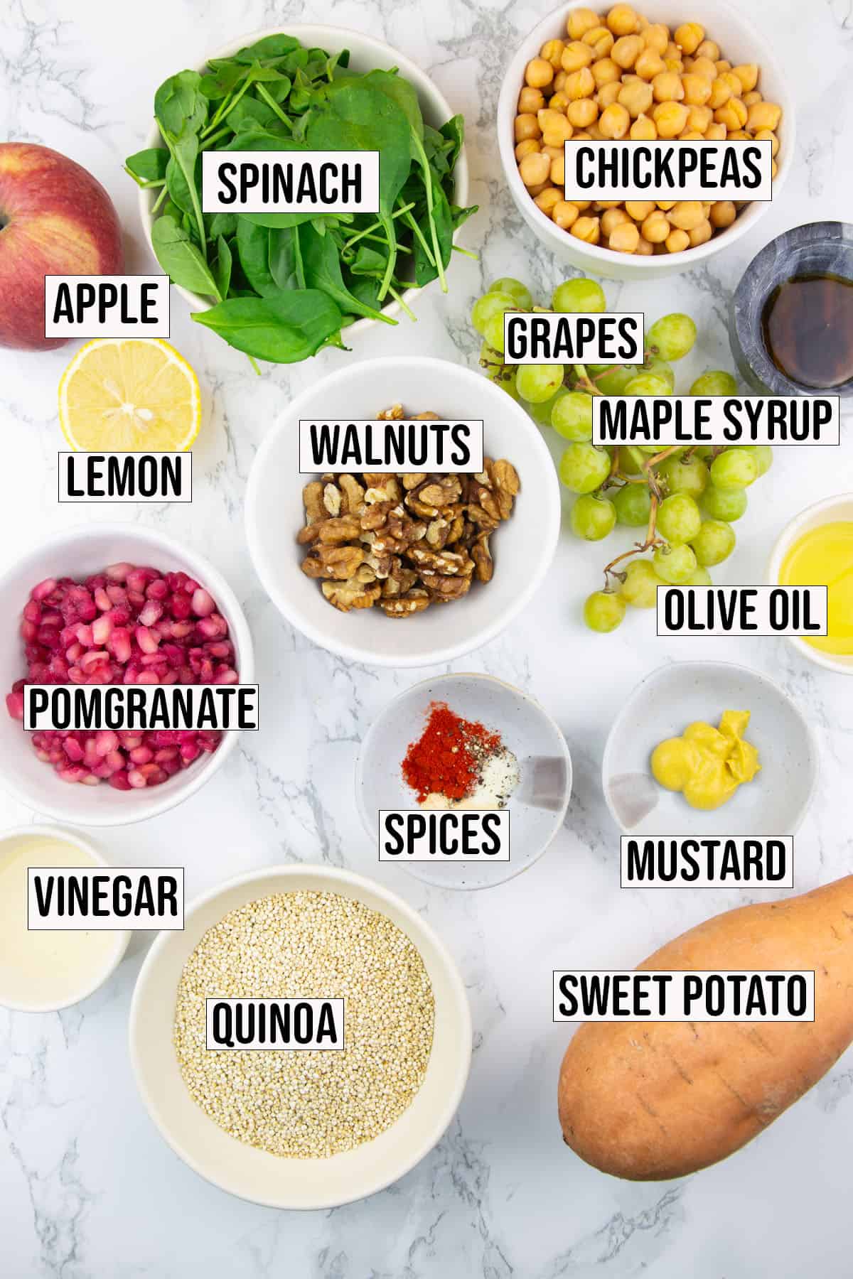 the ingredients that go into this recipe on a marble countertop with labels with the name of each ingredient